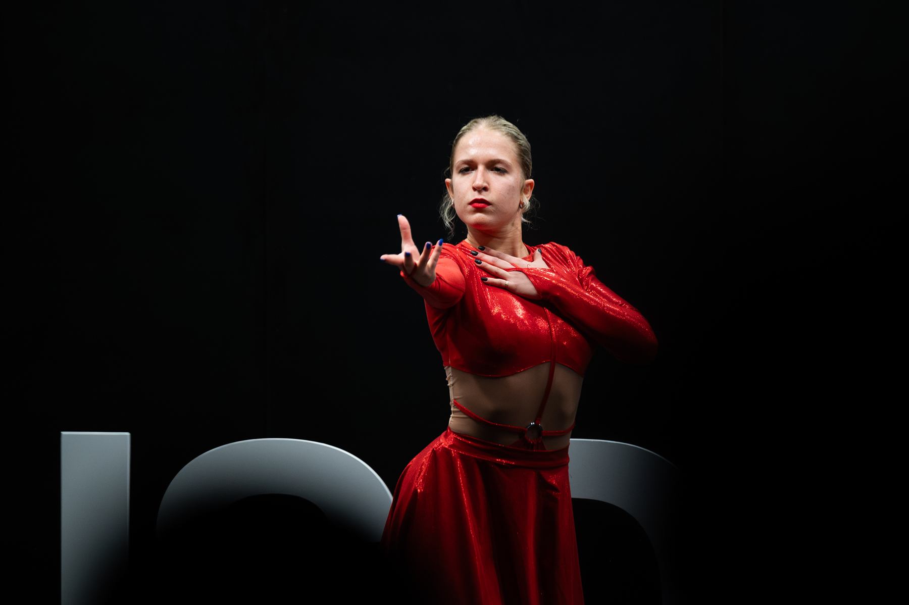 A dancer performing between talks