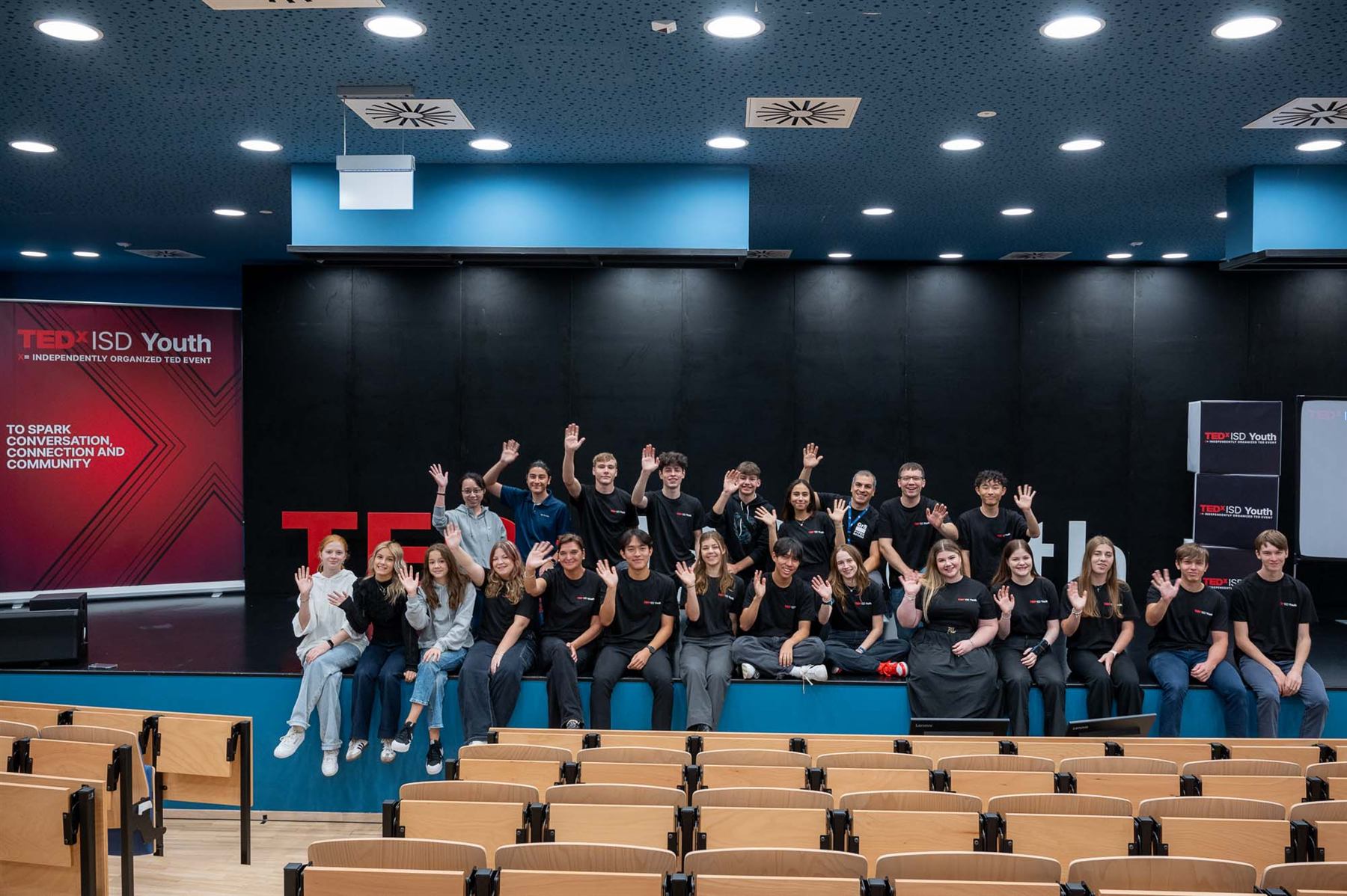 The full TEDxISD Youth organizing team and speakers on stage after the first edition