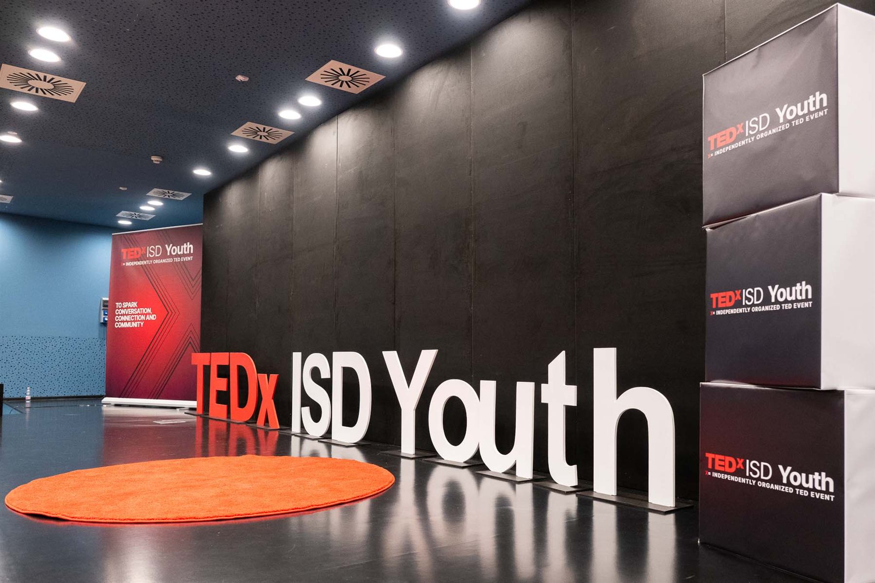 TEDxISD Youth stage letters and signage in the lobby